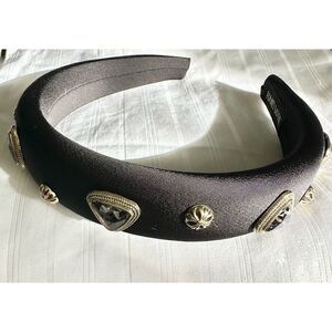 Black headband with gold and dark grey gun metal embellishment